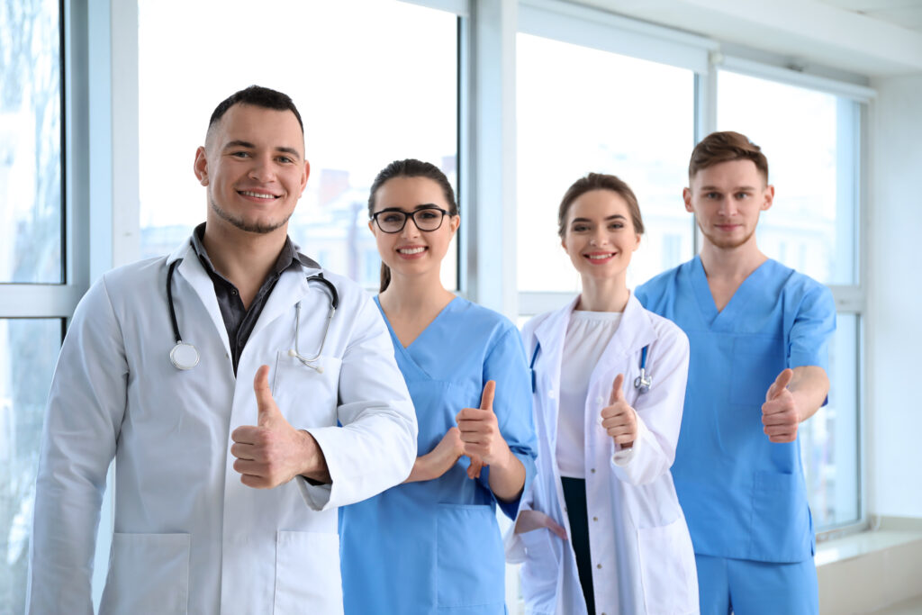 A healthcare team enjoys the benefits of outsourcing AHCCCS billing in Arizona.