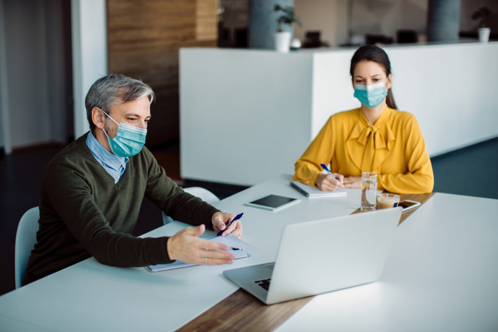 Two medical billers reviewing claims together, showcasing the efficiency of a Texas medical billing service.